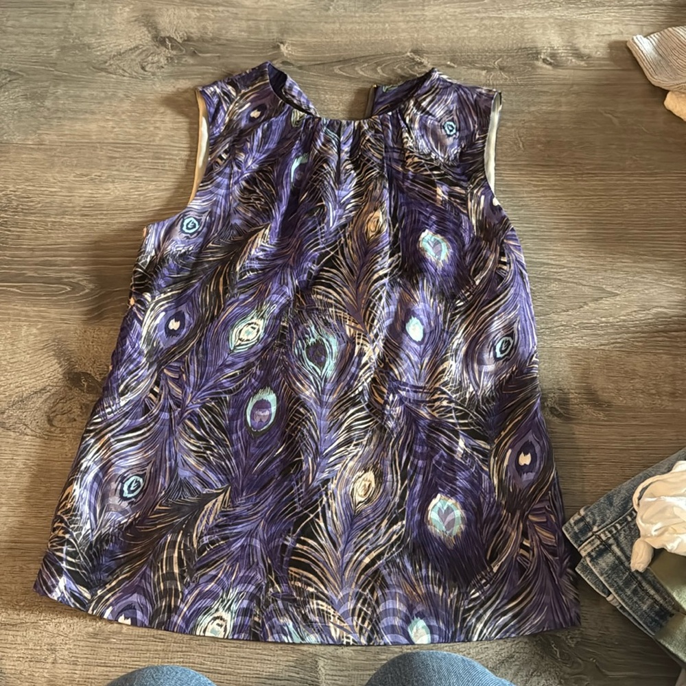 Tory Burch top.